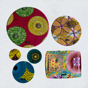 A set of six food covers in bright African Island colours.